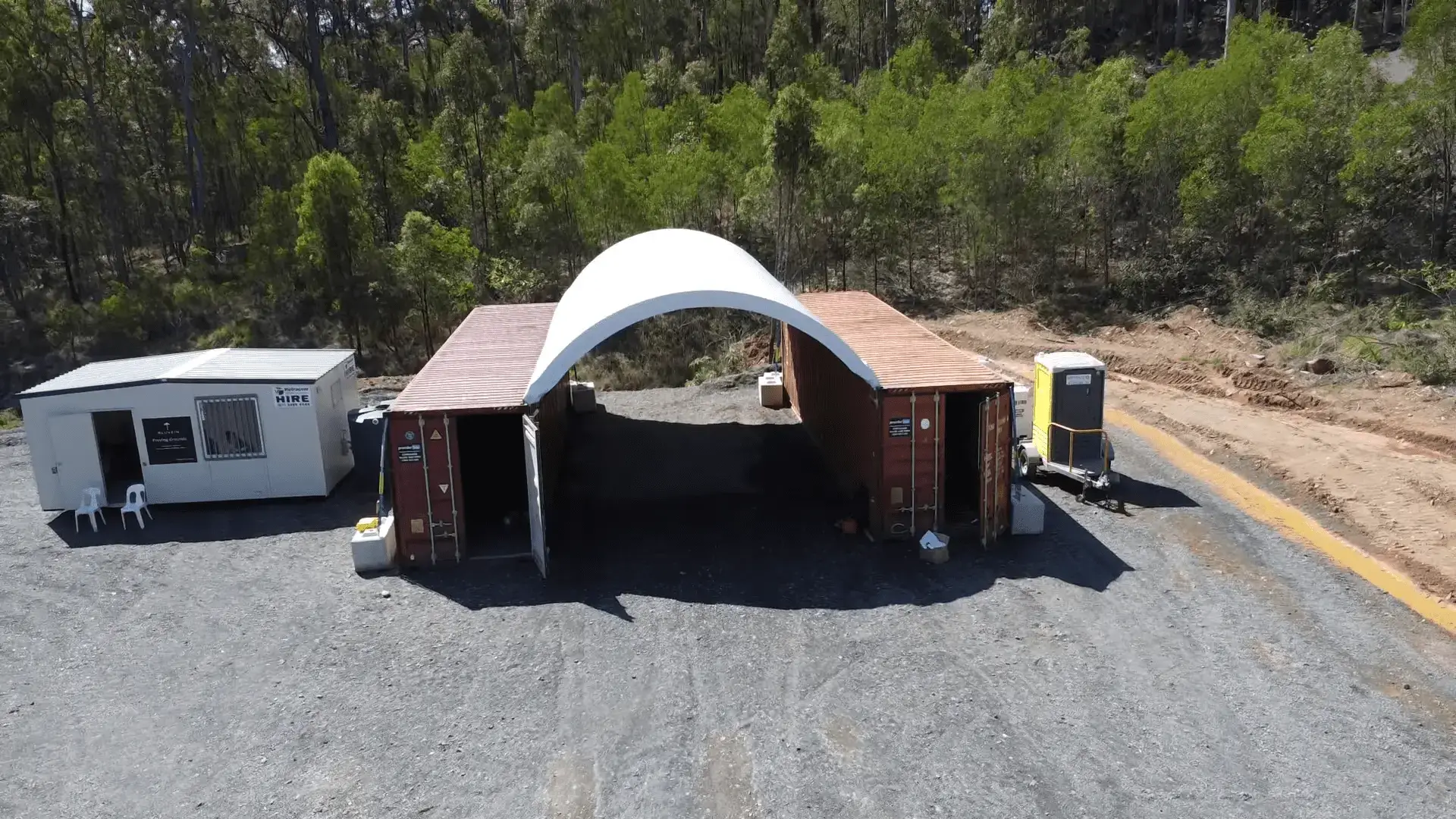 a container dome with two red shipping containers which is used for storagea container dome with two red shipping containers which is used for storage